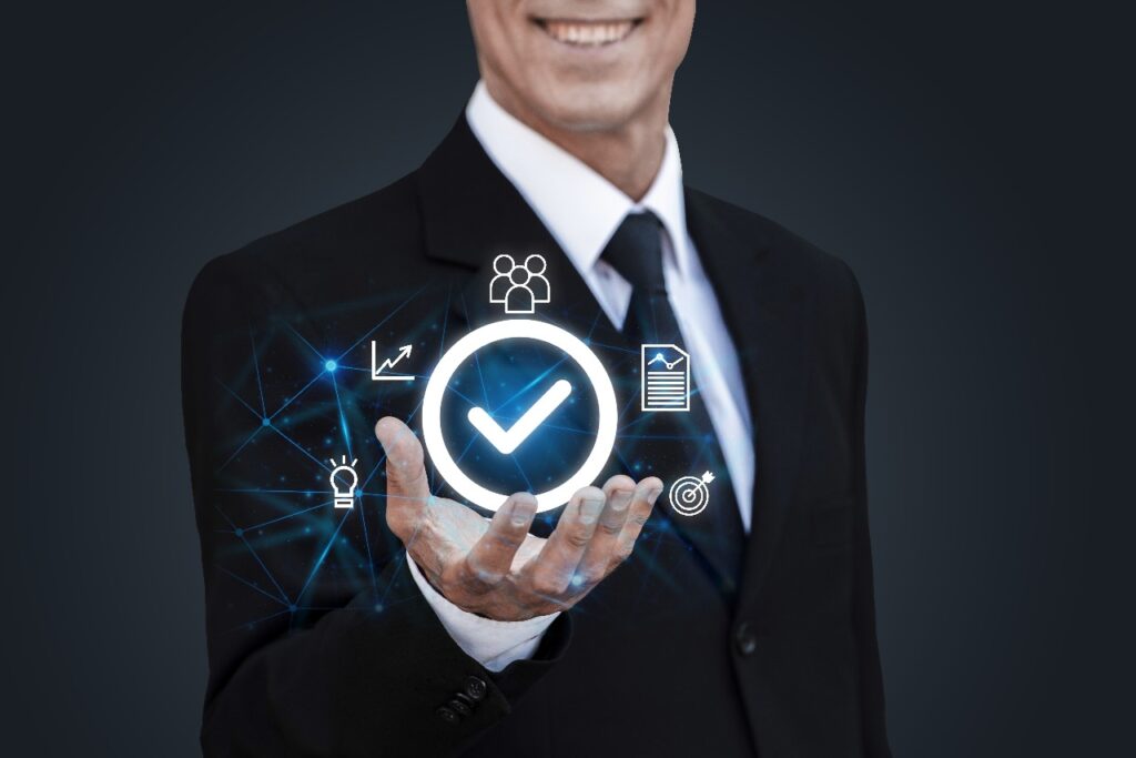 Professional insurance agent in a suit holding a digital checkmark icon representing verified ACA live transfer leads and business success.